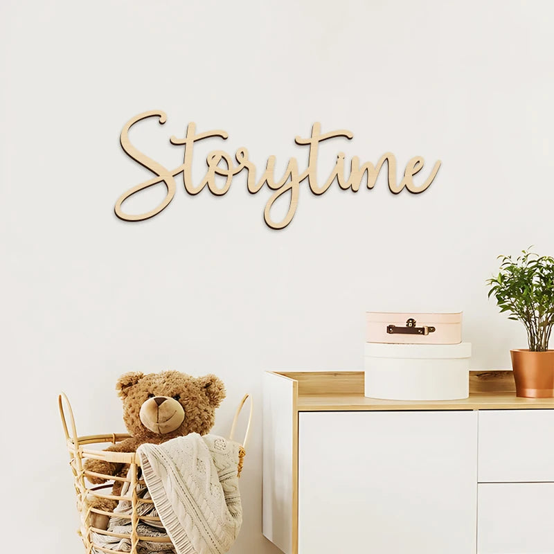 Wooden 'Storytime' sign above a teddy bear in a basket with a white wall background.