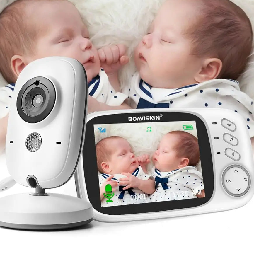 Two babies holding hands with a BOAVISION baby monitor displaying their video feed.