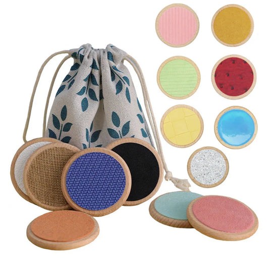 Colorful circular pads with textured surfaces and a drawstring bag on a white background