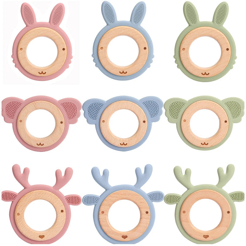 Set of six colorful baby teething rings with animal designs on a white background