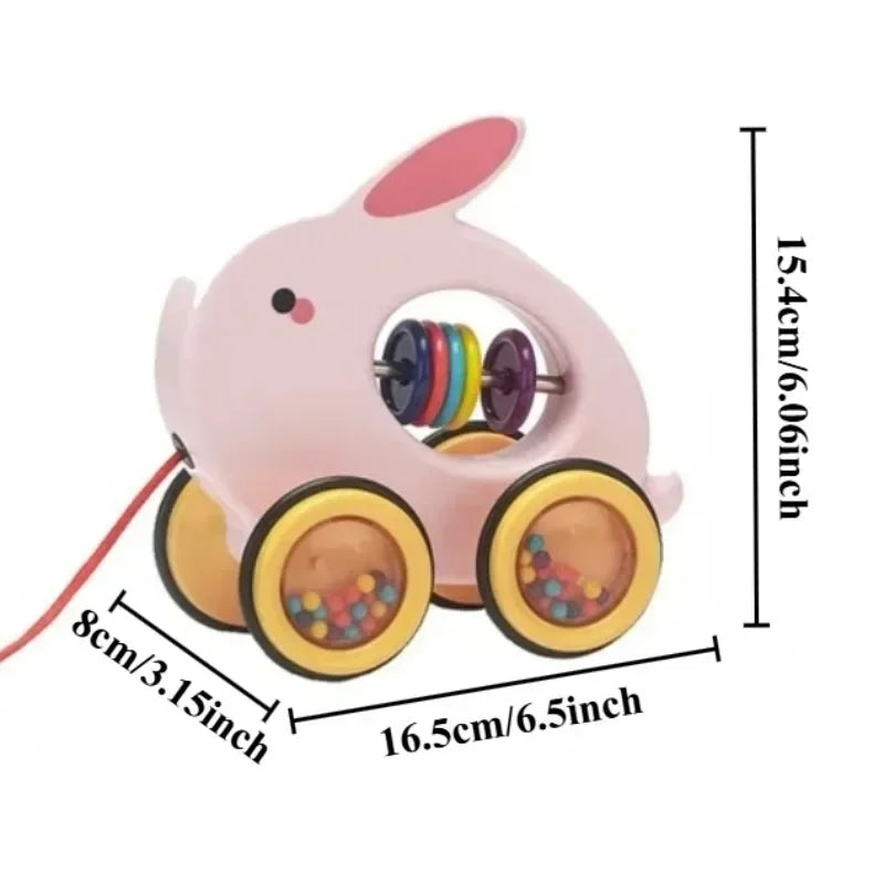 Pink toy with wheels and colorful beads, showing measurements on a white background
